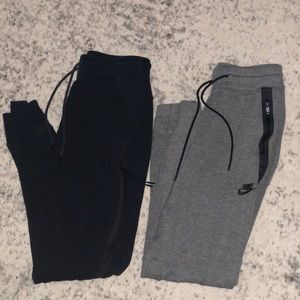 Grey and black pair of Nike joggers